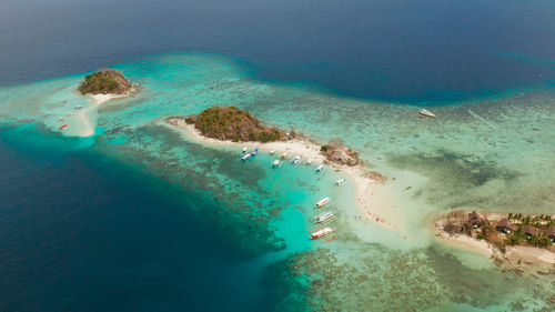 Aerial view tropical island with sand white beach. bulog dos, philippines, palawan. 