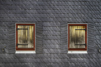 Low angle view of window on wall of building