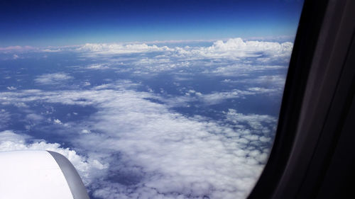 Aerial view of cloudscape seen from airplane window
