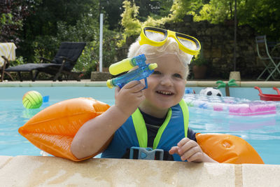 Portrait of happy boy in swimming pool