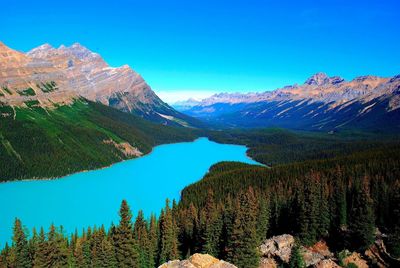 Scenic view of mountains against clear blue sky