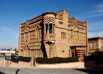 Low angle view of historical building against blue sky