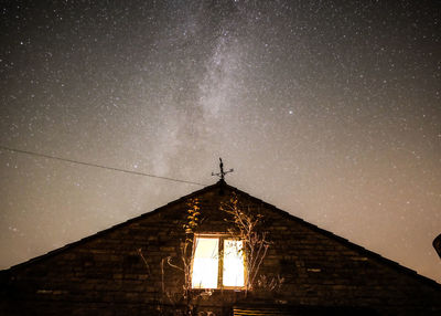 Low angle view of building against sky at night