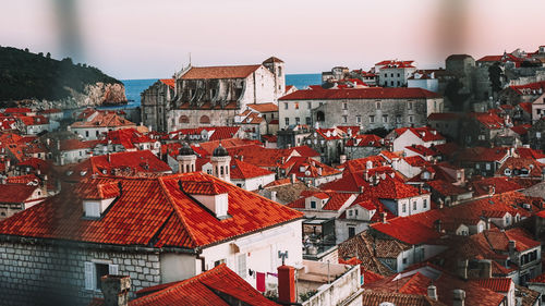 High angle view of buildings in town against sky