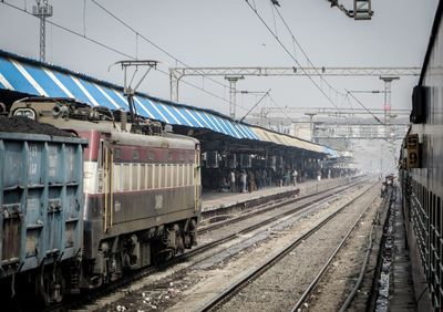 Trains at railroad station in city