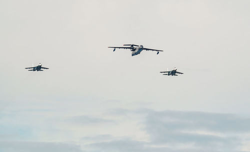 Low angle view of airshow against sky