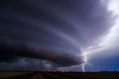 Supercell thunderstorm and lightning bolt with dramatic storm clouds.