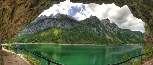 Scenic view of lake and mountains against sky