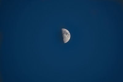 Low angle view of moon in sky at night