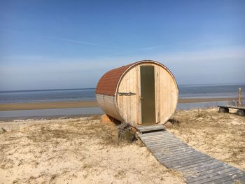 Built structure at beach against sky