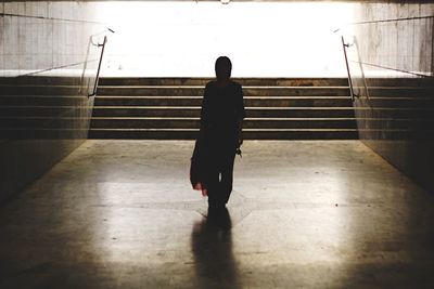 Full length of woman walking on steps