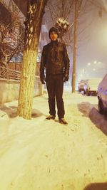 Full length portrait of man standing in snow