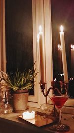 Close-up of tea light candles at home