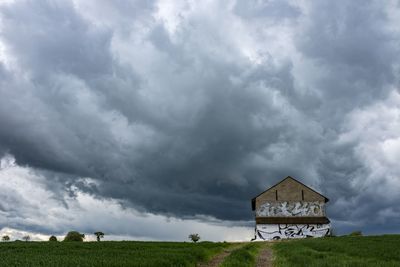 House on field against sky