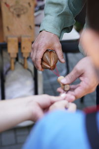 Cropped hand of man holding hands