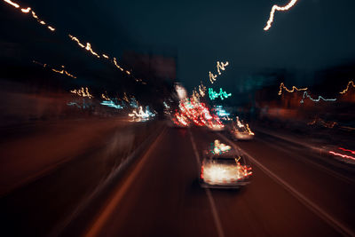 Light trails on city street at night