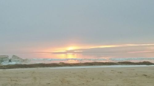 Scenic view of sea at sunset