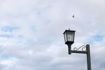 Low angle view of street light against sky
