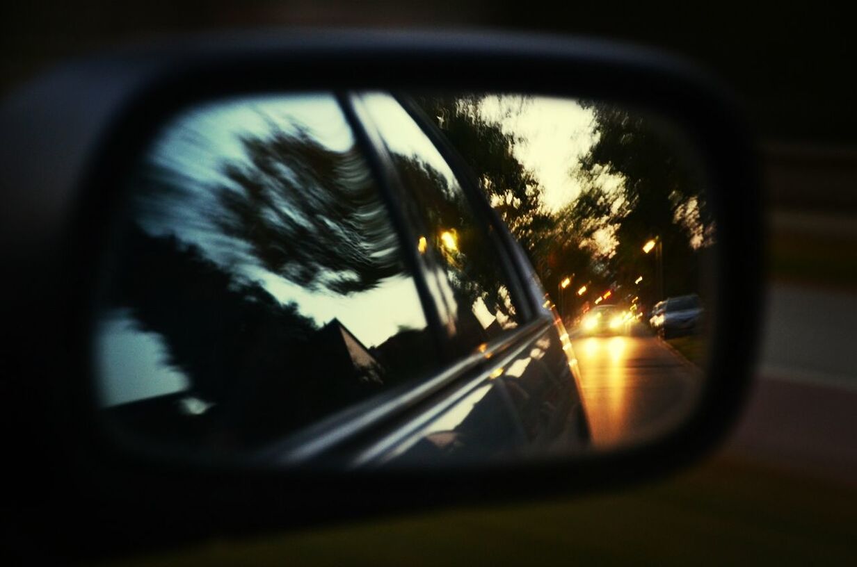 transportation, land vehicle, car, mode of transport, reflection, side-view mirror, glass - material, street, road, transparent, car interior, vehicle interior, close-up, sky, windshield, headlight, sunset, blurred motion, travel, part of