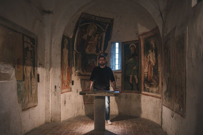 Portrait of man standing in church