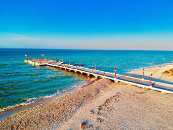 Scenic view of sea against clear blue sky