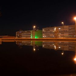 Illuminated city buildings at night