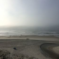 Scenic view of beach against clear sky