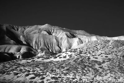 Rock formations on snow covered landscape