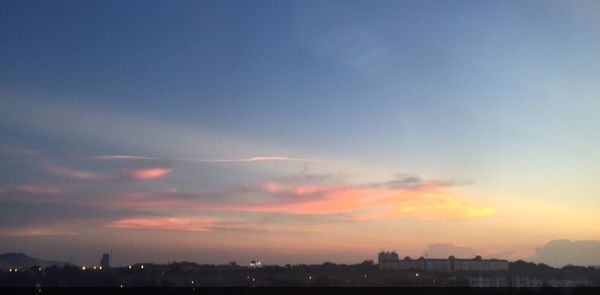 Cityscape against sky during sunset