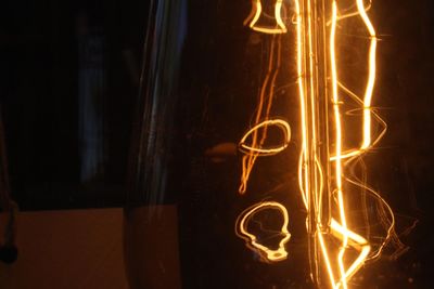 Close-up of illuminated light bulb