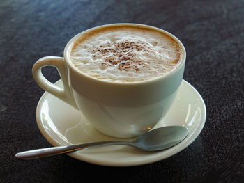 Close-up of coffee cup on table
