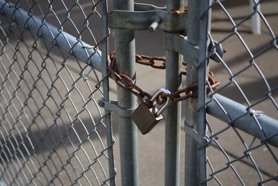 Close-up of padlock on gate