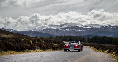 Country road leading towards mountains