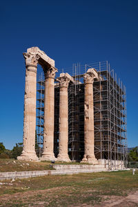 Low angle view of building against clear blue sky