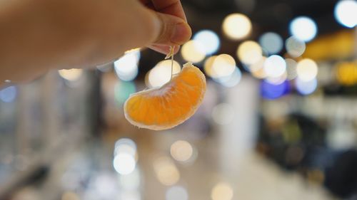 Close-up of hand holding fruit