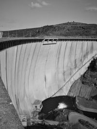 High angle view of dam by river against sky