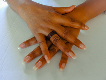 Close-up of woman hand on table