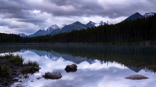 Scenic view of lake and mountains against sky