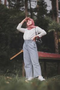 Full length of woman standing on field