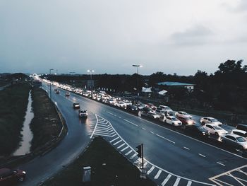 Cars on highway in city at night