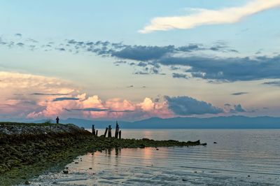 Scenic view of sea against cloudy sky