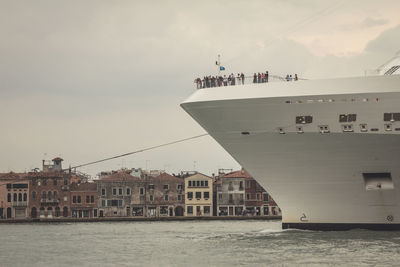 Cruise ship on grand canal against sky