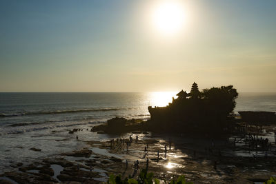 View of tanah lot the balinese temple on the sea during sunset