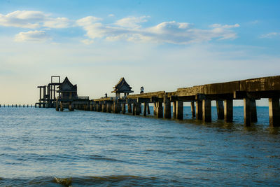 Pier over sea against sky