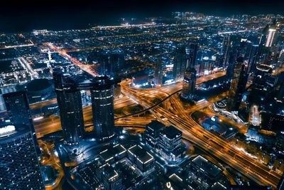 High angle view of illuminated city buildings at night