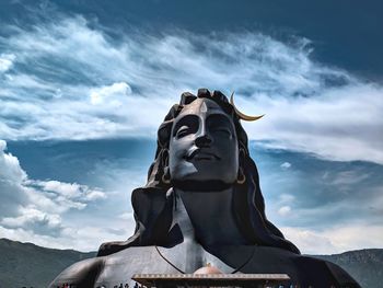 Low angle view of statue against sky