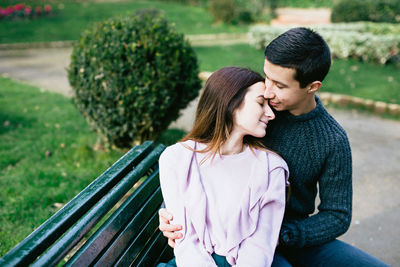 Young couple kissing in park