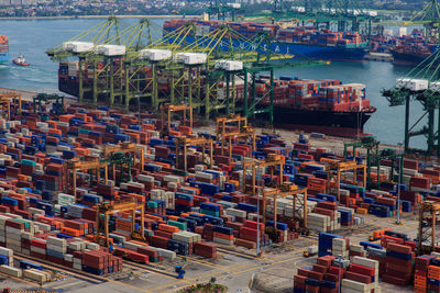 High angle view of boats moored at harbor against sky