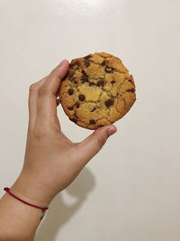 Cropped hand of person holding food