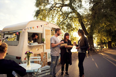 Group of people at market stall